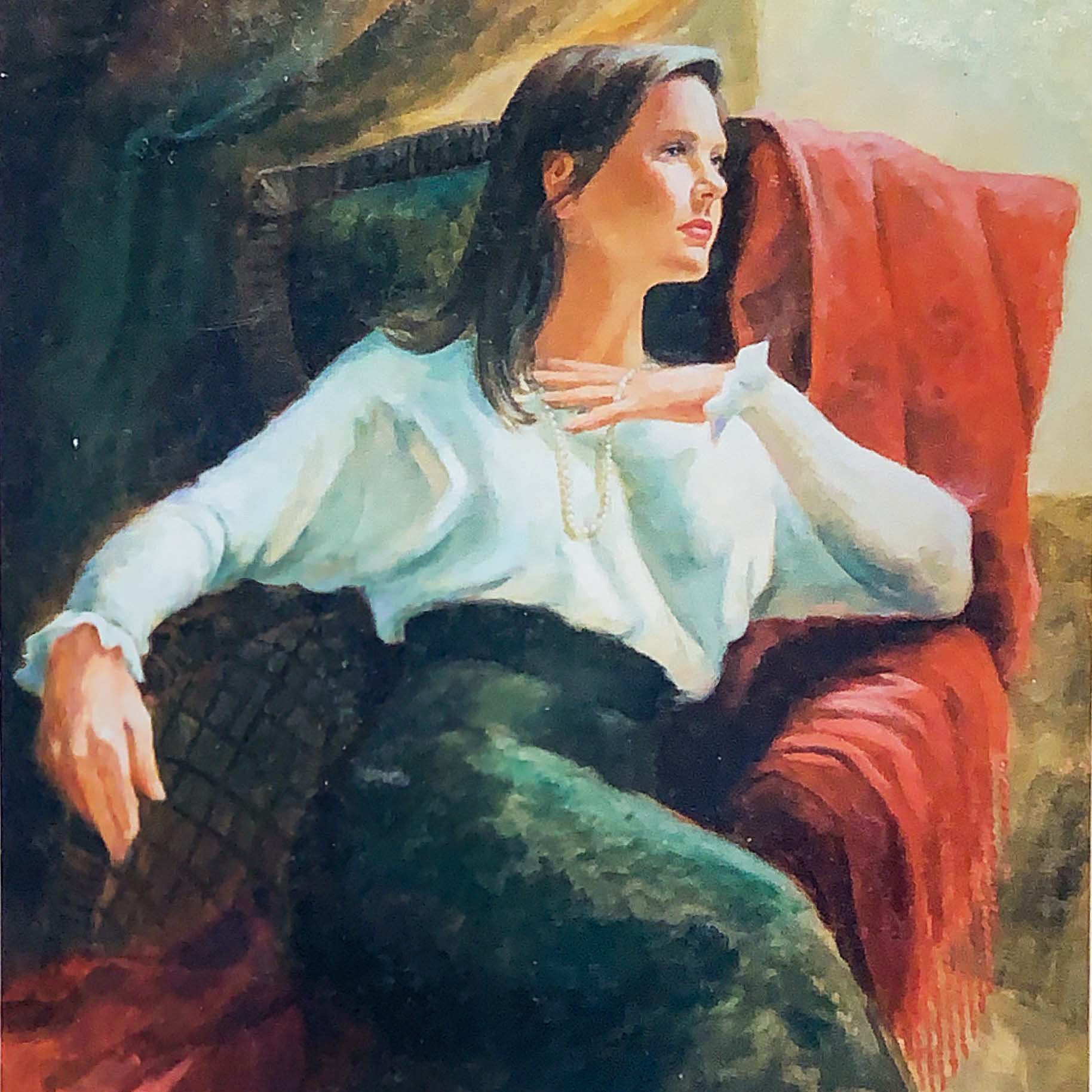 Picture of a woman sitting in a chair.